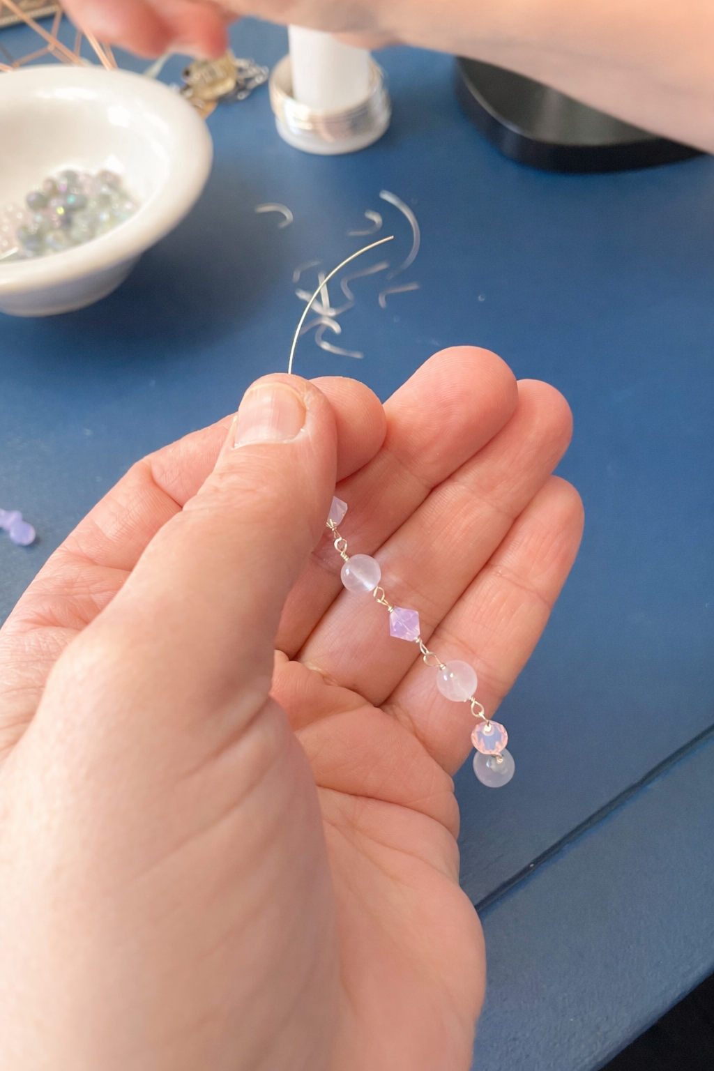 Handcrafting beaded bracelet with freshwater pearls and rose quartz