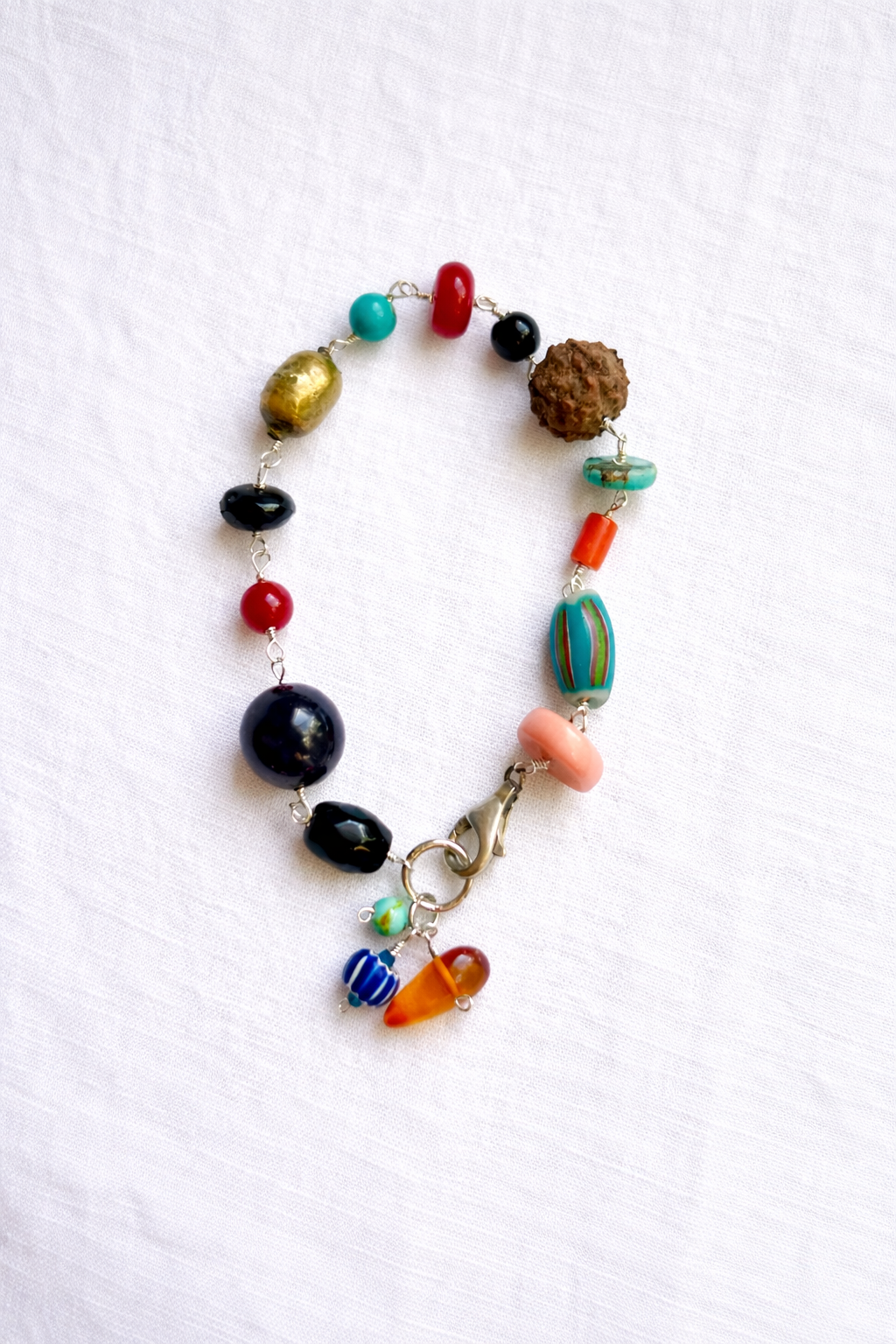 Mixed gemstone charm bracelet with Buddha pendant