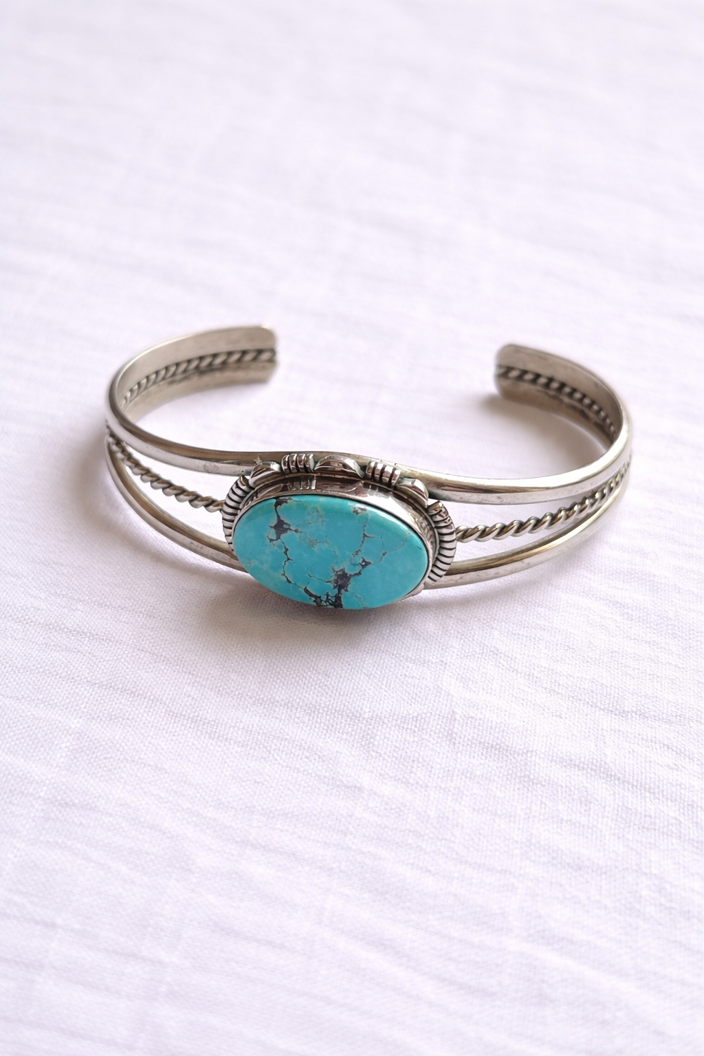 Turquoise oval cuff bracelet with handcrafted silver